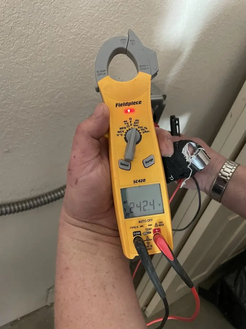 Voltage testing with clamp meter during Electrical Installation Services in Ladue